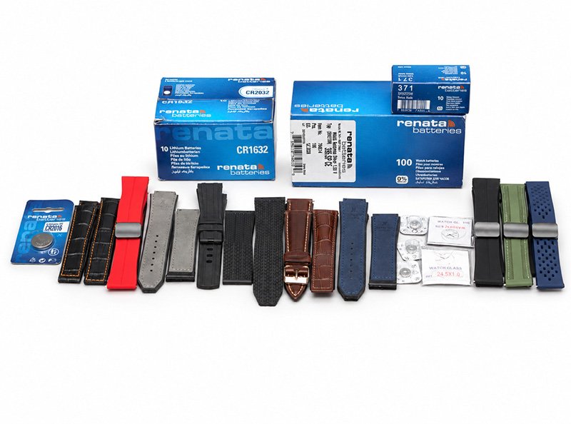 Assortment of replacement watch straps and batteries